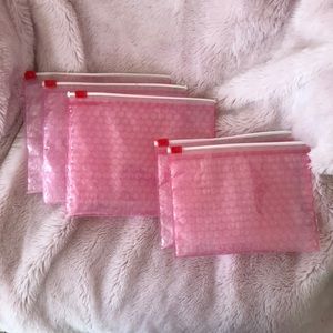 3 glossier pouches